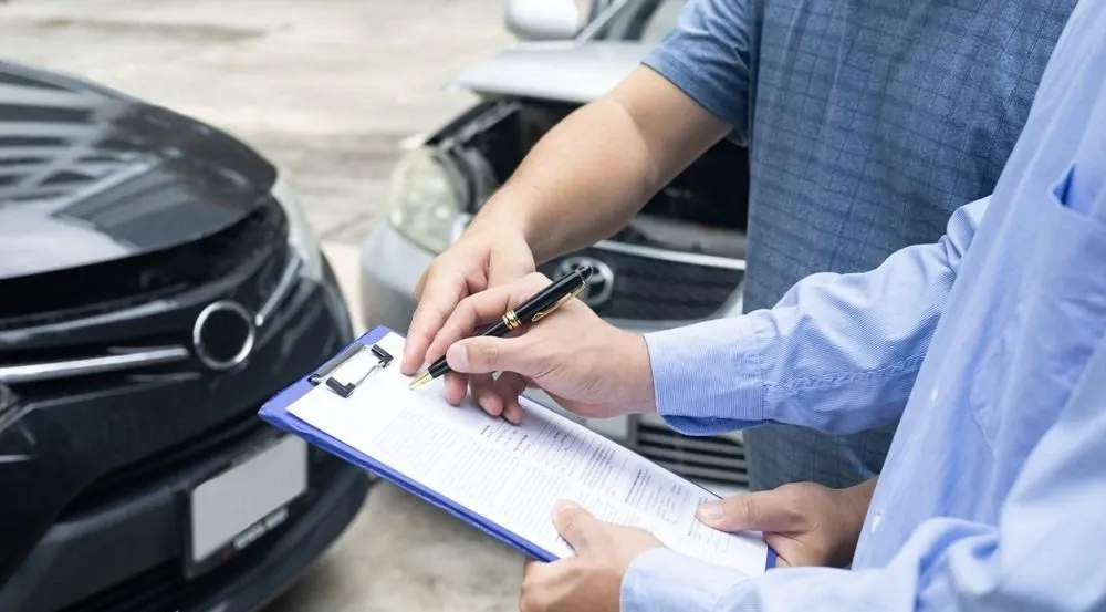 Customer reviewing car insurance policy options and coverage limits